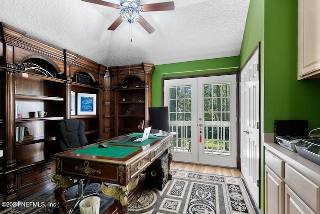 playroom featuring french doors, hardwood / wood-style floors, a textured ceiling, and ceiling fan