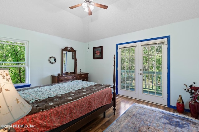 bedroom featuring access to outside, multiple windows, hardwood / wood-style flooring, and ceiling fan