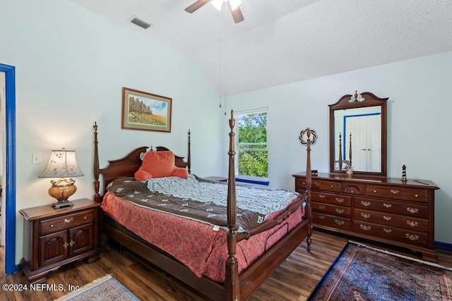 bedroom with dark hardwood / wood-style flooring, vaulted ceiling, and ceiling fan