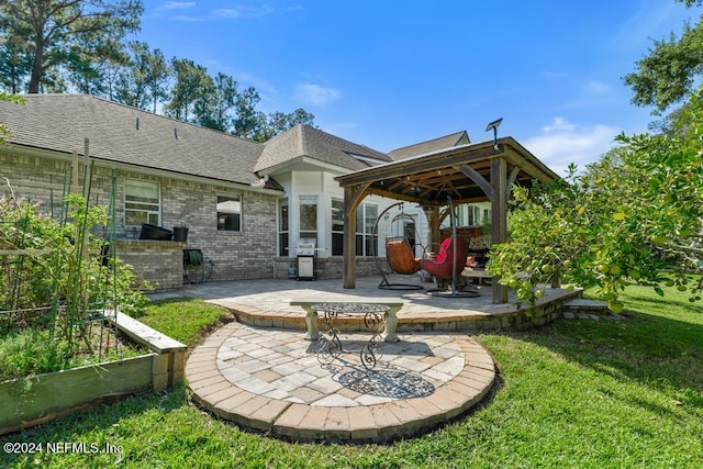 view of patio / terrace featuring a gazebo and grilling area