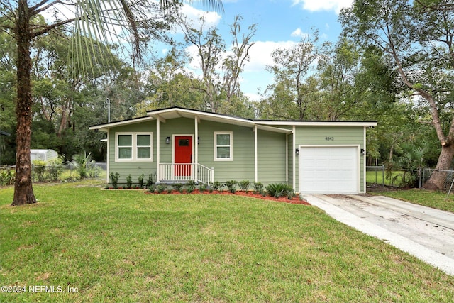 view of front facade featuring a front yard and a garage