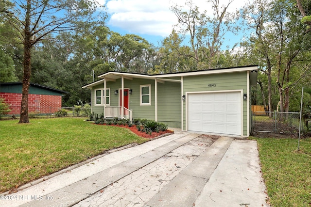 single story home featuring a front yard and a garage