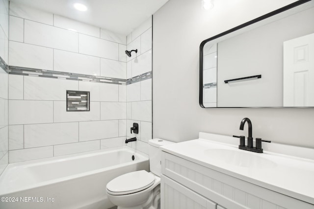 full bathroom with vanity, toilet, and tiled shower / bath