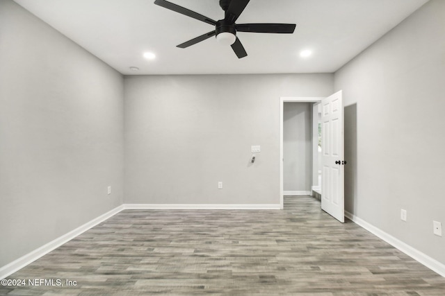 empty room featuring hardwood / wood-style flooring and ceiling fan