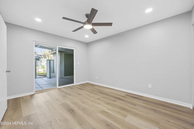 empty room with light hardwood / wood-style floors and ceiling fan