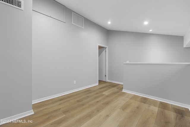 spare room with light hardwood / wood-style floors