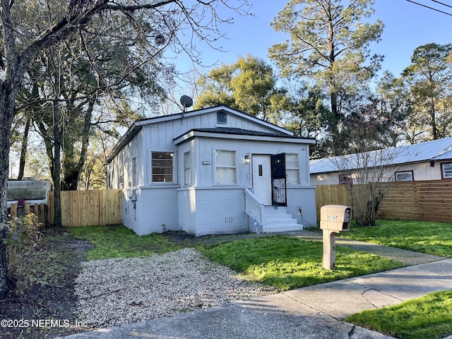 view of front of home with a front yard