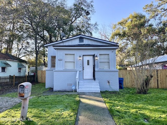 bungalow with a front lawn