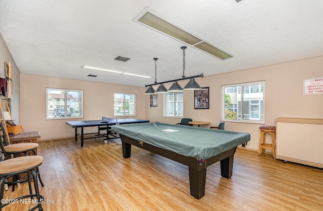 rec room featuring light wood-type flooring, plenty of natural light, and pool table