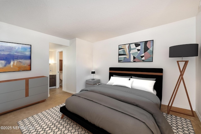 carpeted bedroom featuring connected bathroom