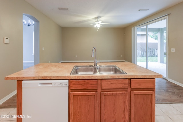 kitchen with a center island with sink, dishwasher, sink, ceiling fan, and light wood-type flooring