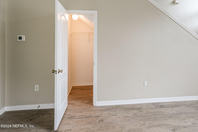 spare room with light hardwood / wood-style flooring