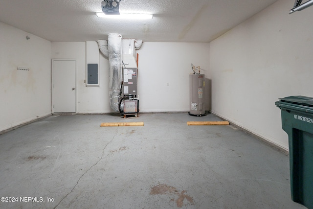 garage featuring electric panel, water heater, and heating unit