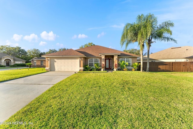 ranch-style home featuring a front yard and a garage