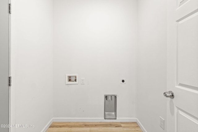 laundry room featuring hookup for an electric dryer, hardwood / wood-style floors, and hookup for a washing machine