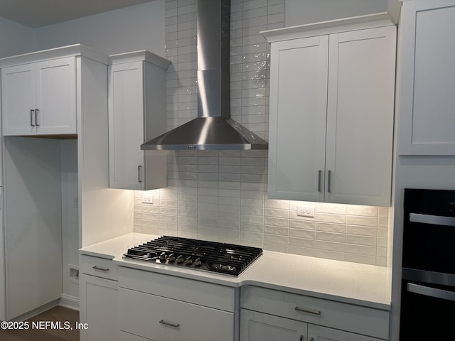 206 Holly Ridge Way, Saint Augustine, FL 32092 - kitchen featuring wall chimney range hood, stainless steel gas stovetop, backsplash, and light countertops