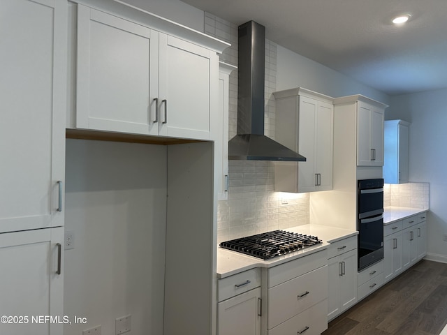 206 Holly Ridge Way, Saint Augustine, FL 32092 - kitchen featuring wall chimney exhaust hood, stainless steel gas stovetop, dark wood-style floors, backsplash, and light countertops
