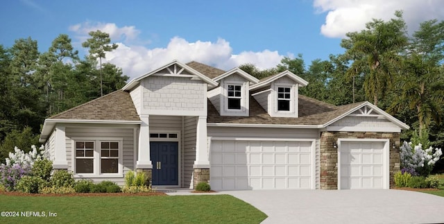 craftsman inspired home featuring a garage and a front lawn