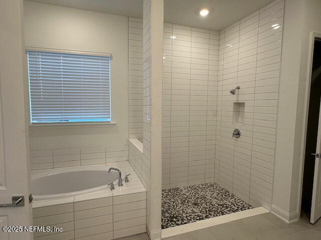 bathroom with independent shower and bath