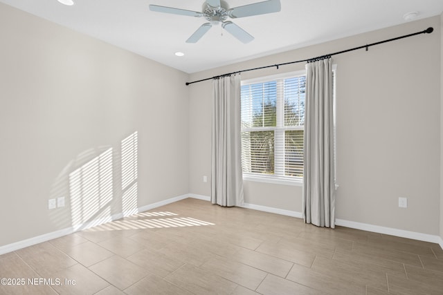 tiled empty room featuring ceiling fan