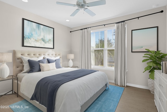 bedroom featuring ceiling fan and light hardwood / wood-style floors