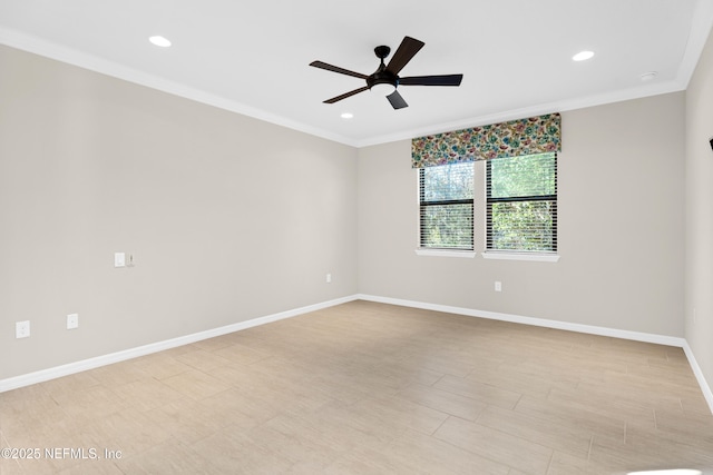 unfurnished room featuring ceiling fan and ornamental molding