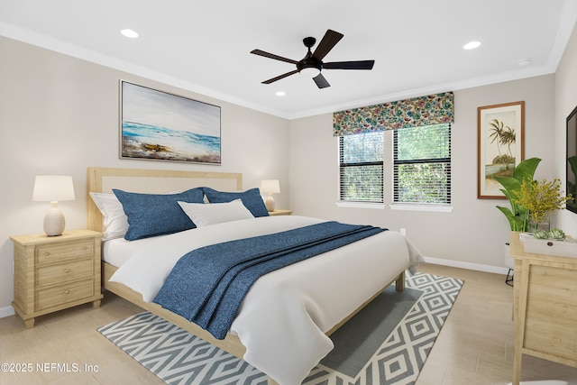 bedroom featuring ceiling fan, crown molding, and light hardwood / wood-style floors