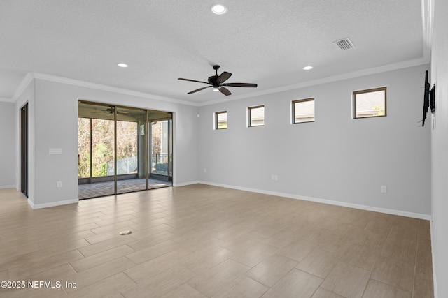 spare room featuring a textured ceiling, ceiling fan, and crown molding