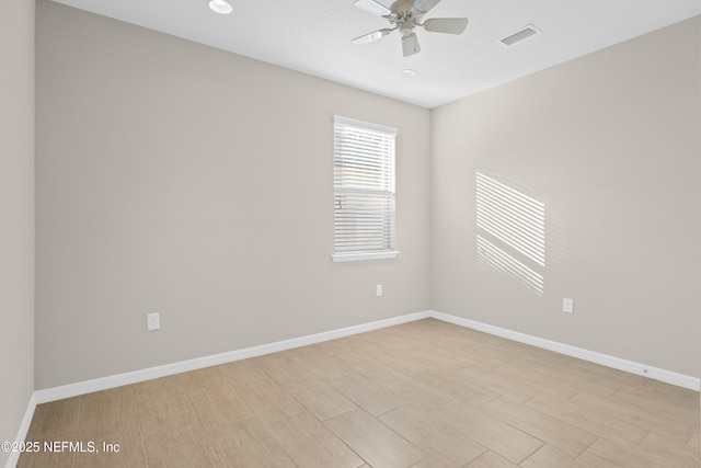 spare room featuring ceiling fan and light hardwood / wood-style flooring