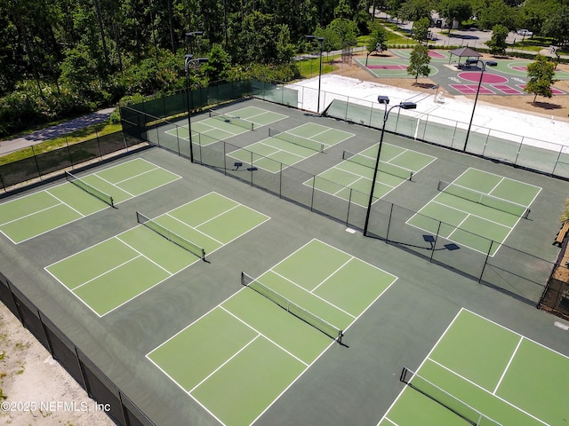 view of tennis court featuring basketball court