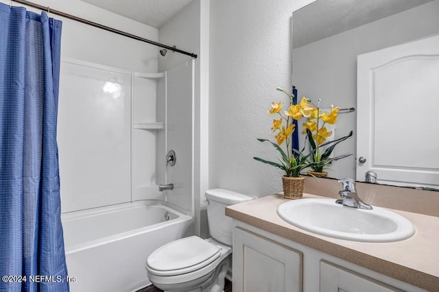 full bathroom featuring vanity, shower / tub combo with curtain, and toilet