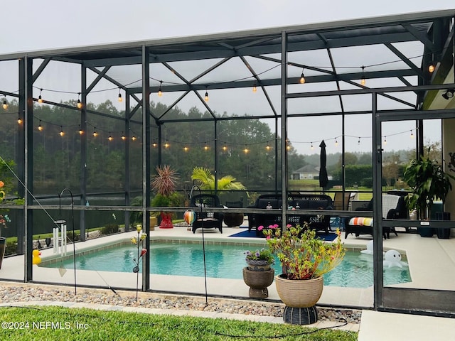 view of pool featuring a patio area and a lanai