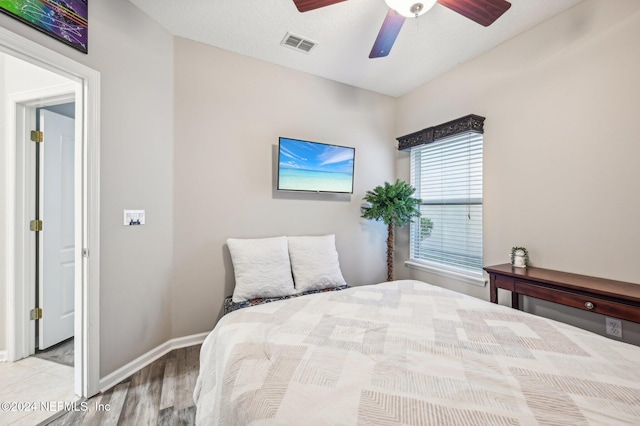 bedroom featuring ceiling fan and light hardwood / wood-style floors