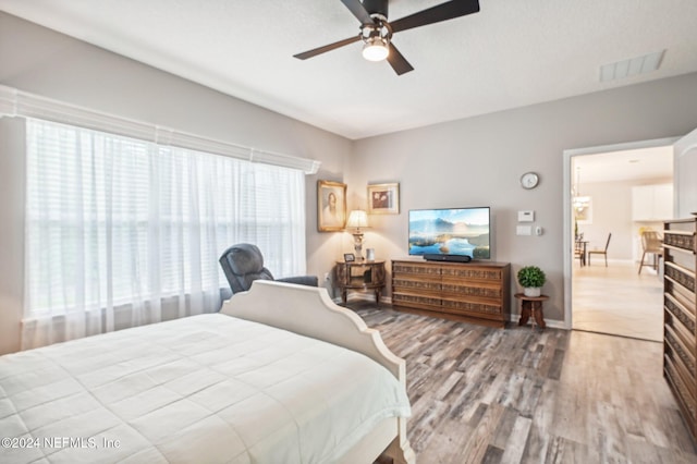 bedroom featuring light hardwood / wood-style flooring and ceiling fan