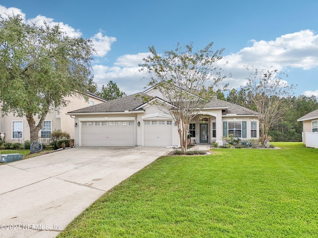 view of front of home featuring a front lawn and a garage