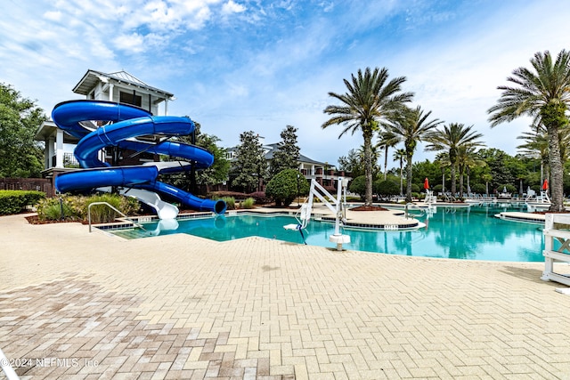 view of pool with a water slide