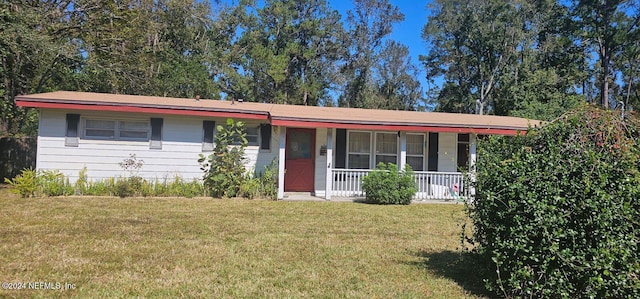 single story home featuring a porch and a front yard