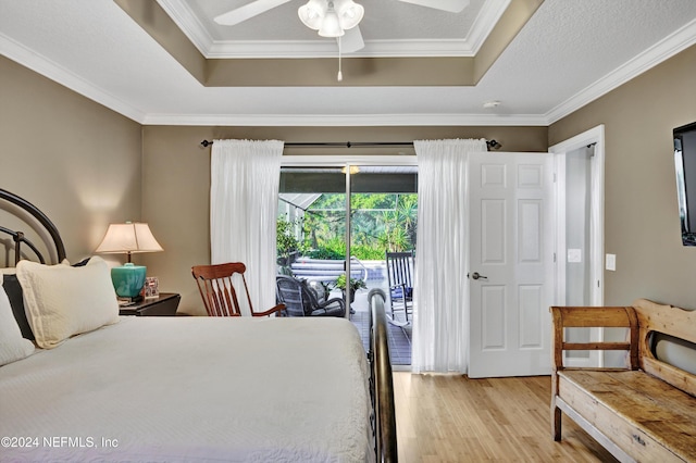 bedroom with ornamental molding, light hardwood / wood-style floors, access to outside, and ceiling fan