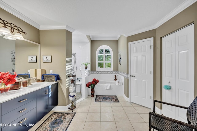 bathroom with vanity, tile patterned floors, ornamental molding, and a washtub