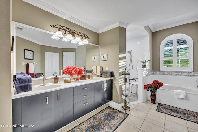 bathroom with vanity, tile patterned flooring, ornamental molding, and a bathing tub