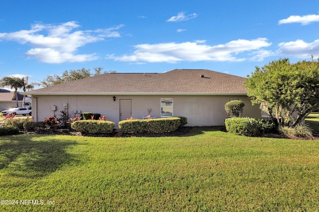 view of home's exterior with a lawn