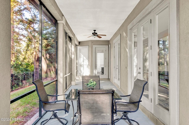 sunroom with plenty of natural light and ceiling fan