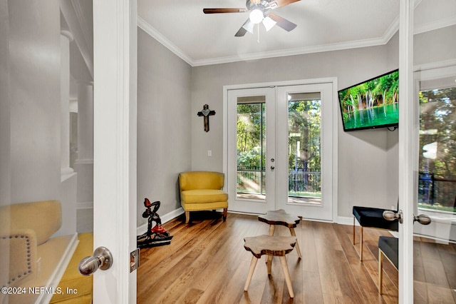 sitting room featuring light hardwood / wood-style floors and french doors