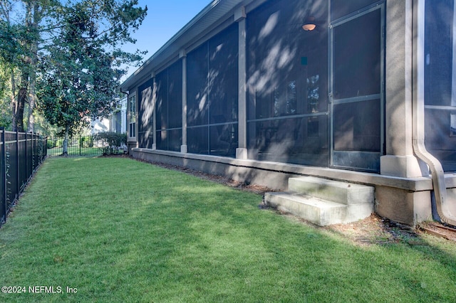 view of yard featuring a sunroom