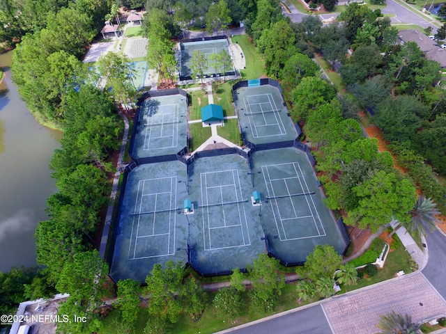 birds eye view of property with a water view