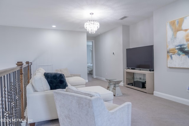 carpeted living room featuring a chandelier