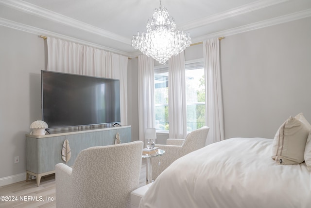 bedroom featuring crown molding, an inviting chandelier, and light wood-type flooring