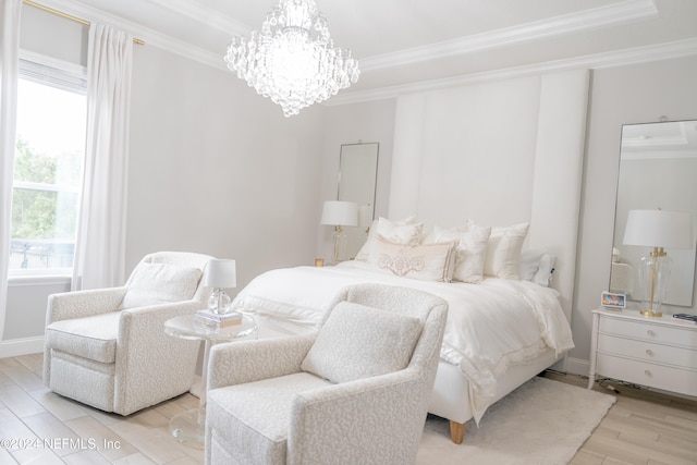 bedroom with light hardwood / wood-style floors, a notable chandelier, ornamental molding, and multiple windows