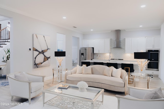 95 Caribbean Pl, Saint Johns, FL 32259 - living room with recessed lighting, ornamental molding, stairs, and light wood-style flooring