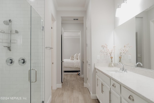 95 Caribbean Pl, Saint Johns, FL 32259 - bathroom with crown molding, vanity, wood finished floors, and a stall shower